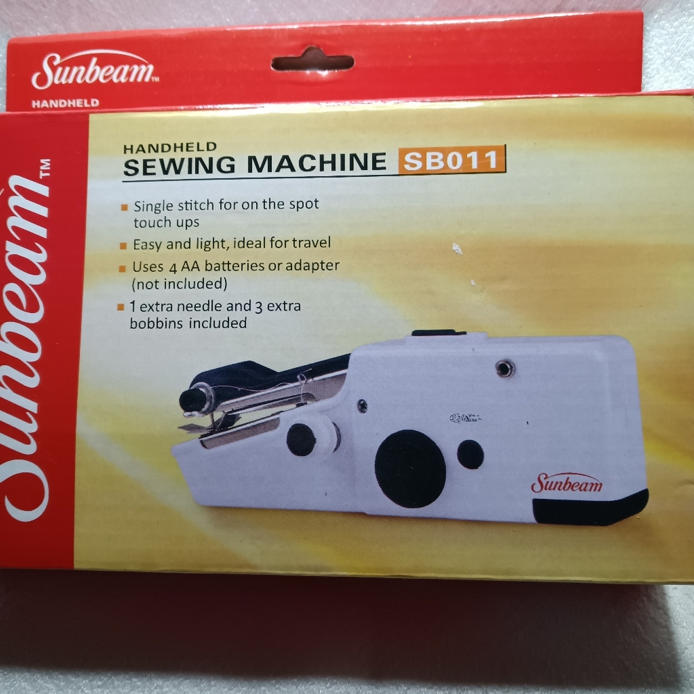 Hand held sewing machine